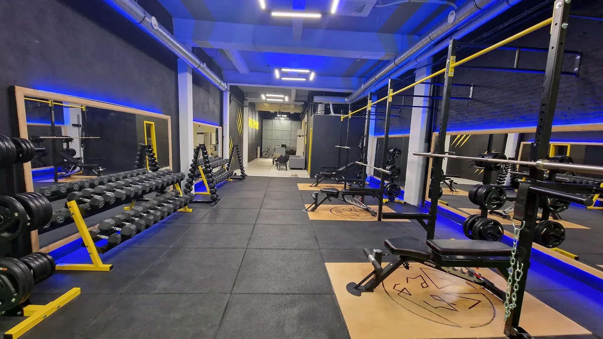 The Wolfpack weights room looking towards the entrance and the lounge corner